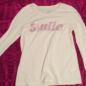 Long sleeve cream with sparkle shirt it says Smile